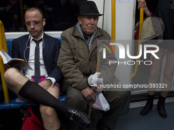 Participants travel surrounded of passengers at the underground during the 6th edition of 