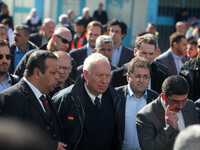 Spanish Foreign Minister, Jose Manuel Garcia-Margallo (C) looks on as he visits a UN run school in in Gaza city on January 13, 2015. Garcia-...