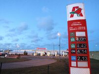 Gdansk, Poland 14th, Jan. 2015 Auchan petrol station in Gdansk sells unleaded petrol for 4 zlotys (0.93 Euro ) per liter. Petrol price in Po...
