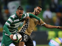 Sporting's defender Miguel Lopes (L) vies for the ball with Boavista's midfielder Anderson Carvalho (R)  during the League Cup  football mat...