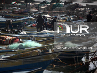 Palestinian fishermen by working at a seaport in Gaza City (