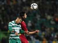 Sporting's forward Fredy Montero (L) heads for the ball with Rio Ave's defender Nelson Monte (R)  during the Portuguese League  football mat...