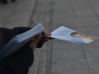 A female giving flyers of the Nea Dimokratia to people which are passing by in Athens at Syntagma.
(