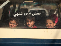 Palestinian students sitting inside a bus in Gaza City (