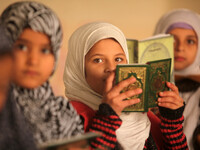 Palestinian students learn to read the Koran  at a seminary, in Gaza, on January 22, 2015. (