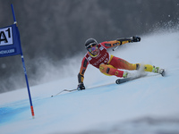 Canada's Dustin Cook, races down the famous Hahnenkamm course during the men's Super-G, at the FIS SKI World Cup in Kitzbuehel, Austria, on...