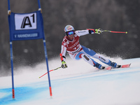 Switzerland's Didier Defago, races down the famous Hahnenkamm course during the men's Super-G, at the FIS SKI World Cup in Kitzbuehel, Austr...