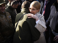 Presidential candidate Yulia Tymoshenko is seen laying flowers at a memorial for victims of the Donbas war and greetings soldiers in Kyiv, U...