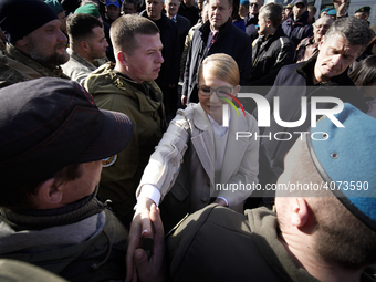 Presidential candidate Yulia Tymoshenko is seen laying flowers at a memorial for victims of the Donbas war and greetings soldiers in Kyiv, U...