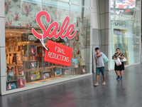 Sales discount sign is pictured at the shopping mall in Bangkok, Thailand on January 31, 2015. Thailand finance ministry cuts economy growth...