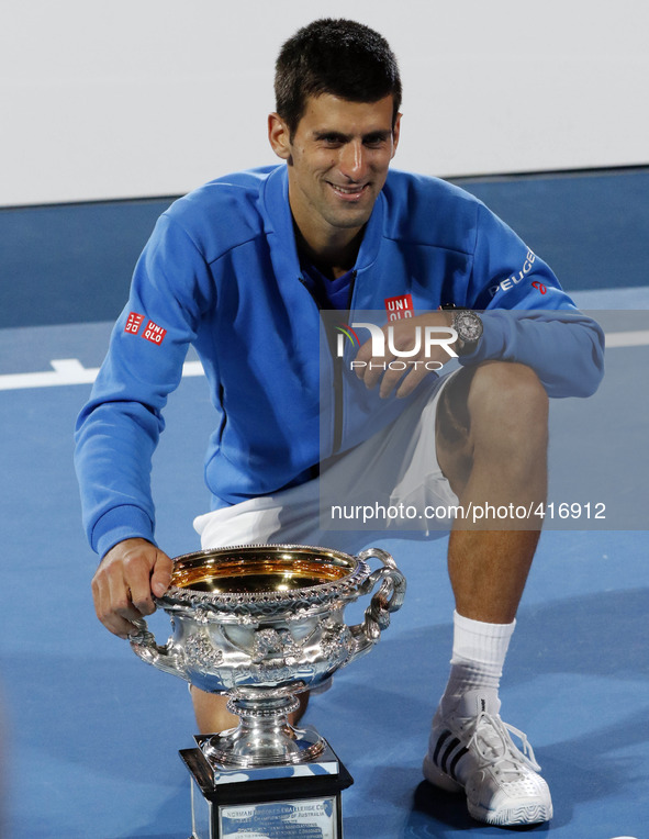 MELBOURNE, Feb. 1, 2015 () -- Novak Djokovic of Serbia poses with the trophy after winning his men's singles final match against Andy Murray...