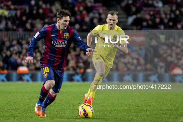Barcelona, Catalonia, Spain. Fabruary 1, 2015 Leo Messi of Barcelona and Cheryshev of Villarreal in action during the spanish league match b...