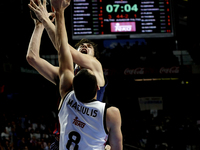 Real Madrid's Lithuanian player Jonas Maciulis and Barcelona´s Croatian player Ante Tomic  during the Basket Euroleague 2014/15 match betwee...