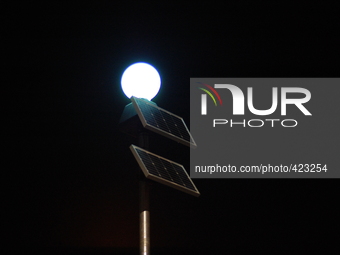 A solar powered street lamp, on Friday 6th February 2015, illuminating the night in Manchester, England. -- A street light using solar energ...