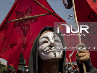 A protester takes part in Labor Day demonstrations outside the presidential palace on May 1, 2019 in Manila, Philippines. Thousands of Filip...