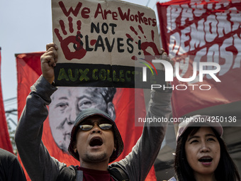 Protesters shout slogans as they take part in Labor Day demonstrations outside the presidential palace on May 1, 2019 in Manila, Philippines...