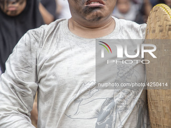 Jakarta, 01 May 2019 : A man with theatrical expression symbolic as how hunger he is as a labor during the demonstration. Thousands of Labor...