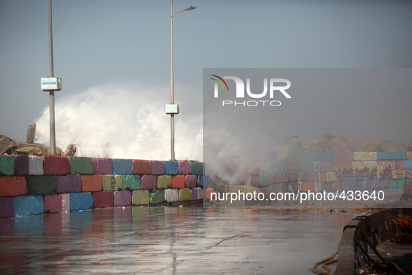 Large waves from rough seas collide with the break wall at the Gaza seaport in Gaza City on February 12, 2015 , during a winter storm. 