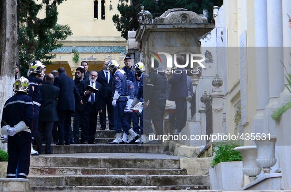 Rabbi pray over the body of French actor Roger Hanin during his funeral in the Jewish cemetery of St. Eugene Algerian capital Algiers Februa...