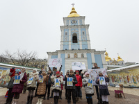 On February 13, 2015 children from Kyiv and the conflict zone in eastern Ukraine hold cards with the words 