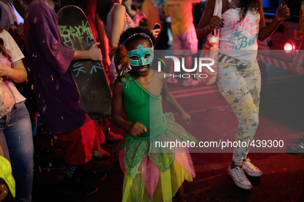 A child girl dances samba on a Carnival parade in Augusta Street in Sao Paulo, Brazil on February 13, 2015. It is estimated that millions of...