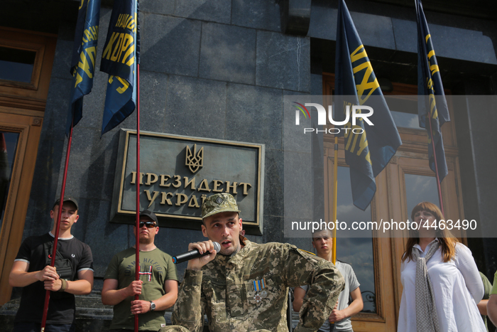Foreign military volunteer to Ukrainian Army has a speech during a rally at Presidential Administration in Kyiv, Ukraine, June 4, 2019. Vete...