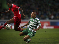 Sporting's midfielder Joao Mario (R)  is tackled by Gil Vicente's midfielder Semedo during the Portuguese League  football match between Spo...