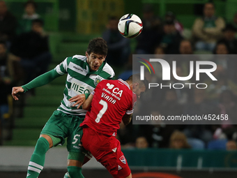 Sporting's defender Tobias Figueiredo (L) heads for the ball with Gil Vicente's forward Diogo Viana  (R) during the Portuguese League  footb...