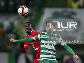 Gil Vicente's forward Simy (L) heads for the ball with Sporting's defender Paulo Oliveira (R)  during the Portuguese League  football match...