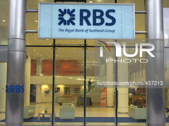 Light emanating from a Royal Bank of Scotland in central Manchester Thursday 13th November 2014. -- The Royal Bank of Scotland (RBS) trades...