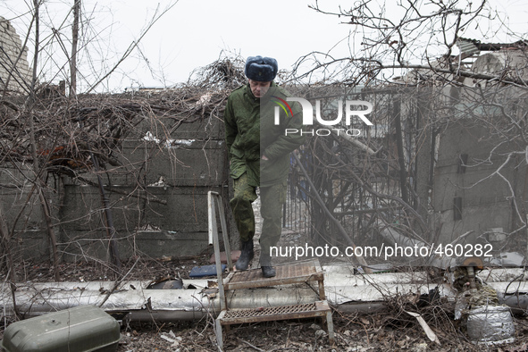 A fighter of self-proclamed People's Republic of Donetsk walks in the destroyed airport of the eastern Ukrainian city of Donetsk, on Februar...