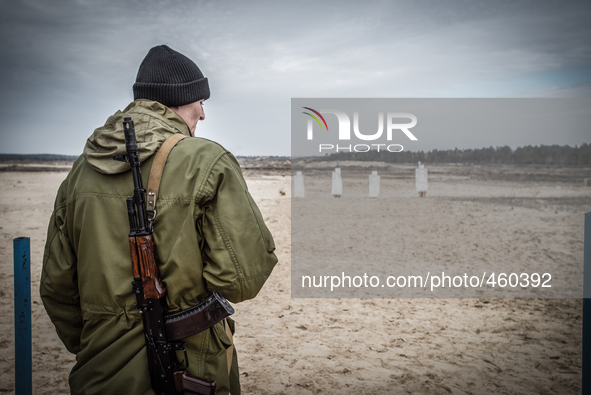 Cadet with Kalashnikov gun standing in front of targets during firing training with SPG recoilless guns and Kalashnikov guns at the 169th Tr...