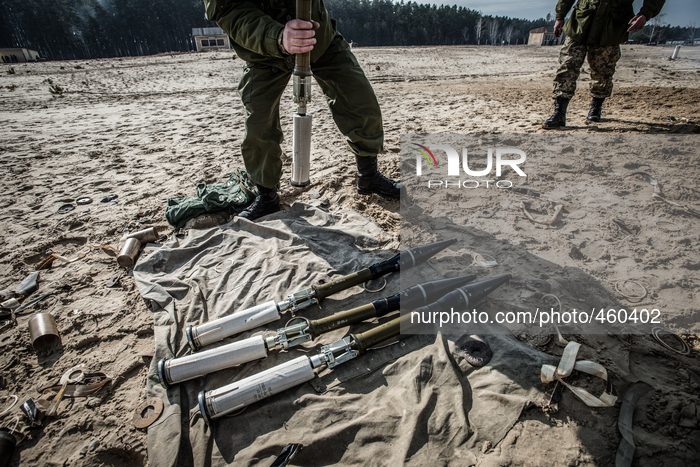 Cadet holds rocket of SPG recoilless gun during firing training with SPG recoilless guns and Kalashnikov guns at the 169th Training center o...