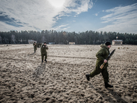 Group of cadets run to the place of training during firing training with SPG recoilless guns and Kalashnikov guns at the 169th Training cent...