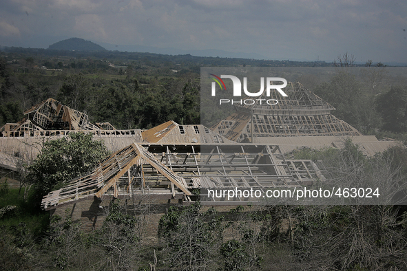 The building houses collapsed due to the eruption of Mount Sinabung (not in picture) in a deserted village, Simacem village, Sumatra, Indone...