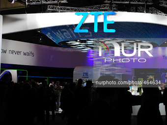 People walking front the Chinese company stand, ZTE, during the first day of Mobile World Congress 2015 in Barcelona, on March 2nd, 2015 (