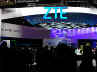 People walking front the Chinese company stand, ZTE, during the first day of Mobile World Congress 2015 in Barcelona, on March 2nd, 2015 (