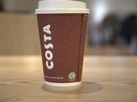A Costa Coffee take-away cup, showing the Rainforest Alliance logo, in a central Manchester branch of Costa on Tuesday 24th February 2015. (
