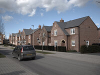 A car travelling down a street in the new housing estate in Northwich, Cheshire, England, on Tuesday 3rd March 2015. -- A new housing estate...