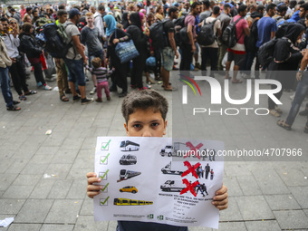 Hundreds of migrants demonstrate outside Budapest Keleti railway station in Budapest, Hungary, September 5, 2015. A record number of refugee...