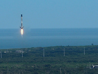 After a one day launch delay due to weather, the first stage of a SpaceX Falcon 9 rocket approaches Landing Zone 1 after a successful launch...