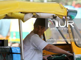Sunita Chaudhary is one of Delhi's only female auto rickshaw drivers during work on the eve of International Women's Day in Delhi on March 7...
