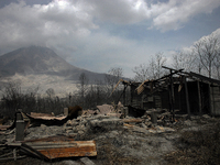 In this photo taken on March 7, 2015, the houses were damaged by the eruption of Mount Sinabung eruption lay in ruins recently as seen in th...