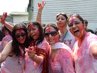 Hindu devotees poses for a picture during the Holi Festival in Bangkok, Thailand on March 8, 2015. (