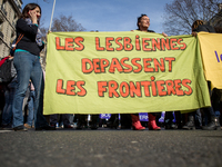 Women take part in a parade marking International Women's Day in Paris on March 8, 2015. (