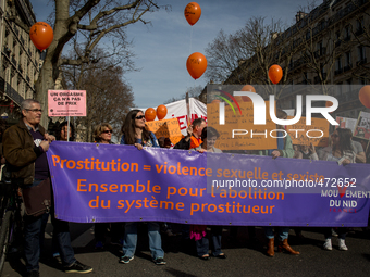 Women take part in a parade marking International Women's Day in Paris on March 8, 2015. (