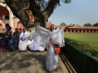 A group of widows from Varanasi and Vrindavan to visit Taj Mahal to celebrate International Women's Day in Agra on March 8,2015. Internation...