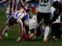 Atletico de Madrid's Spanish forward Fernando Torres and Valencia's Spanish midfielder Javi Fuego during the Spanish League 2014/15 match be...