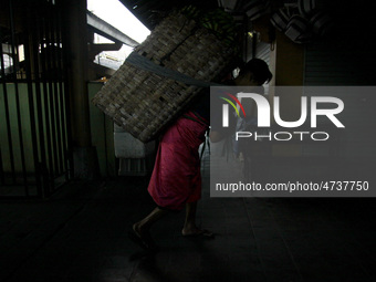 Female freight workers serve customers in Beringharjo traditional market, Special Region of Yogyakarta province, on Monday, August 5, 2019....