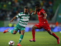 Sporting's midfielder Nani (L) vies for the ball with Penafiel's defender Hector Quinones (R)  during the Portuguese League  football match...